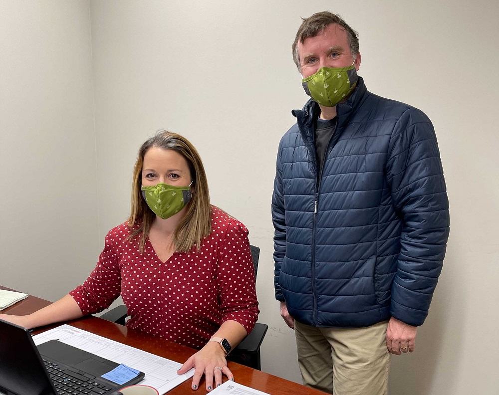 Mandi Whiting and Kris Nordholz wearing masks